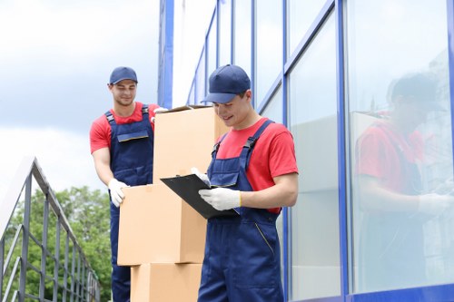 Man and van removals team loading furniture in London street