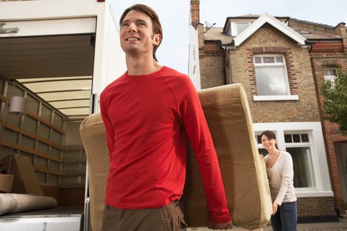 Crew loading furniture into a truck in London