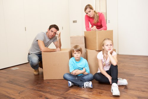 Unpacking boxes in a London apartment after a move